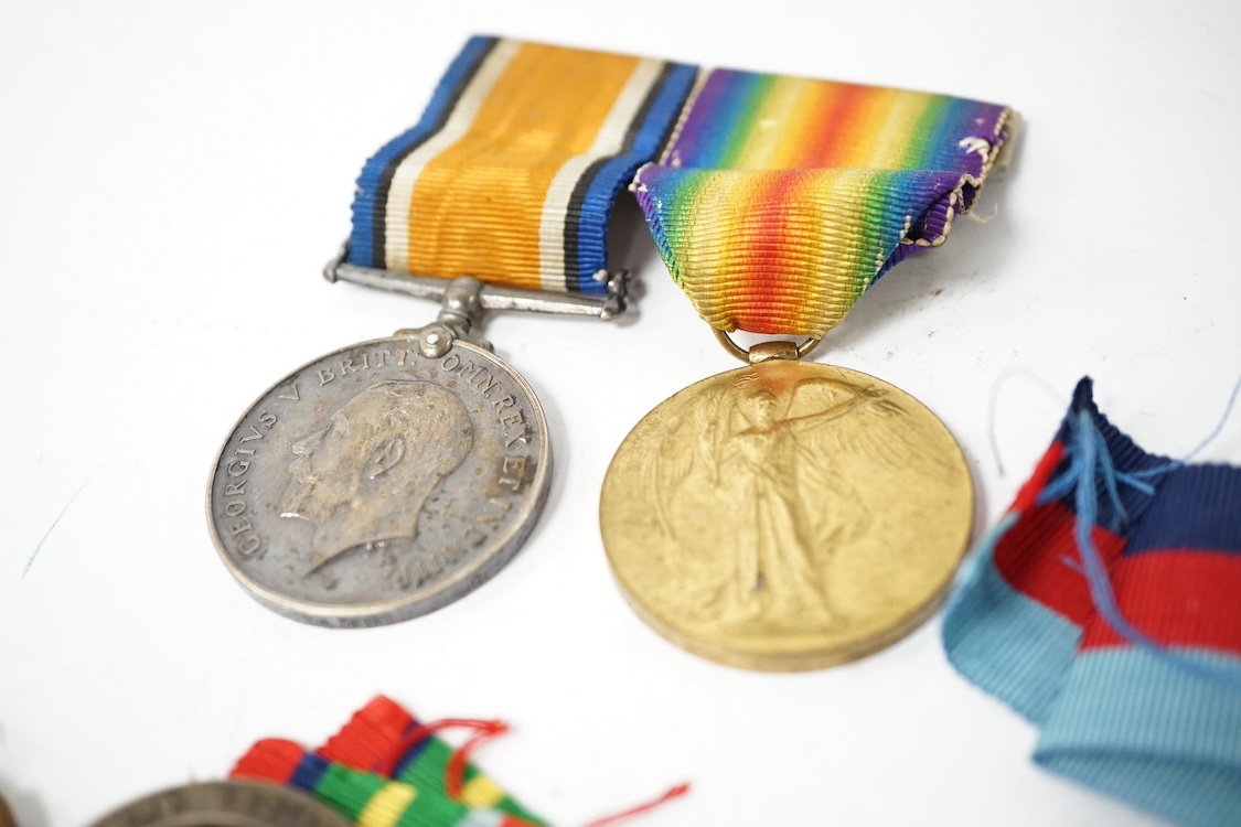 Nine military medals including; a First World War medal pair to T3-026887 DVR. C. Oldfield. A.S.C., a WWII group comprising; The Atlantic Star, The 1939-1945 Star, The Italy Star and The 1939-1945 Medal with a clasp for